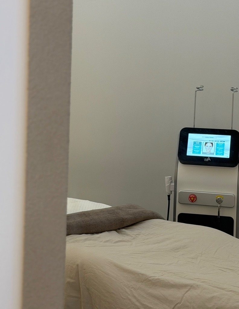 A view through the doorway towards the HI-REX system and treatment bed.